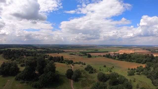 Breathtaking aerial footage showcasing lush countryside and expansive fields.