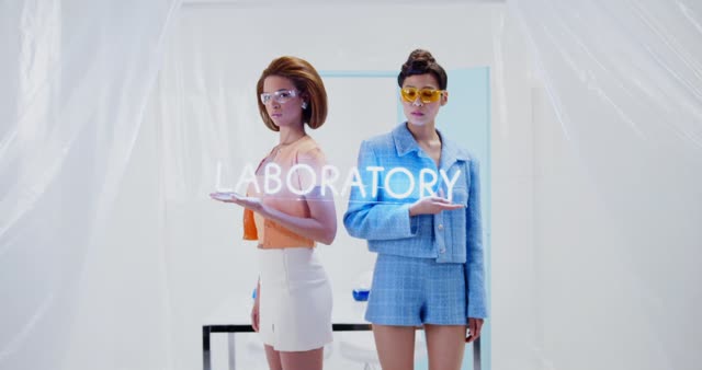 Fashion-forward models in a laboratory setting, blending style with science.
