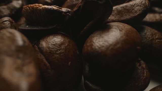 Detailed shots of roasted coffee beans showcasing textures and richness.