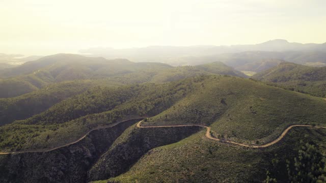 Stunning drone footage capturing Mallorca's lush green hills in summer.