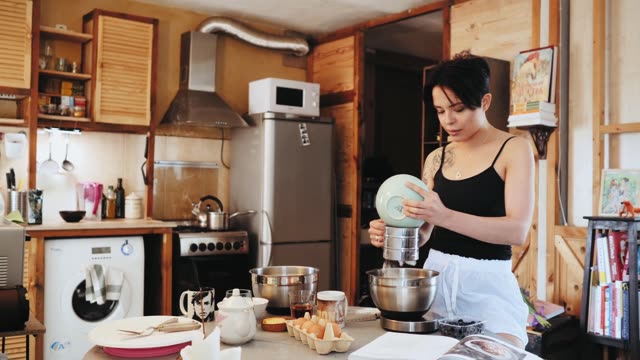 A loving couple baking in a cozy kitchen, sharing affection and joy.