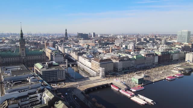 Aerial footage of Hamburg's cityscape with iconic landmarks on a clear day.