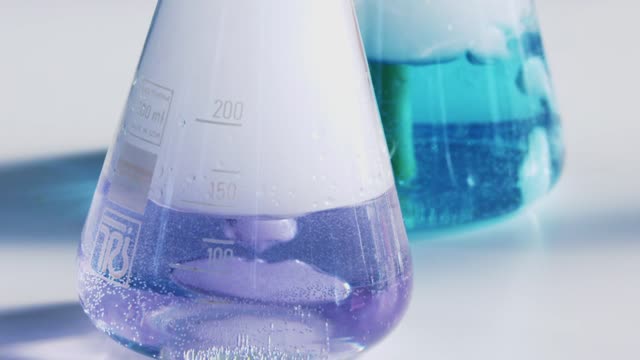 Dynamic footage capturing vibrant chemical reactions in a laboratory setting.